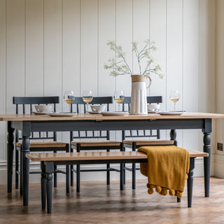 Country style dining table with bench seating