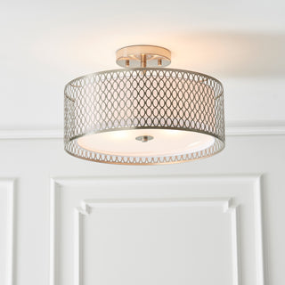 Ceiling light fixture with decorative mesh design on a white wall background